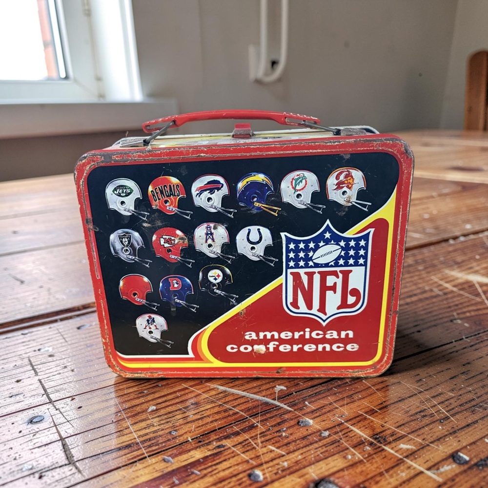 NFL American Conference Metal Lunchbox in Red, Black, Yellow